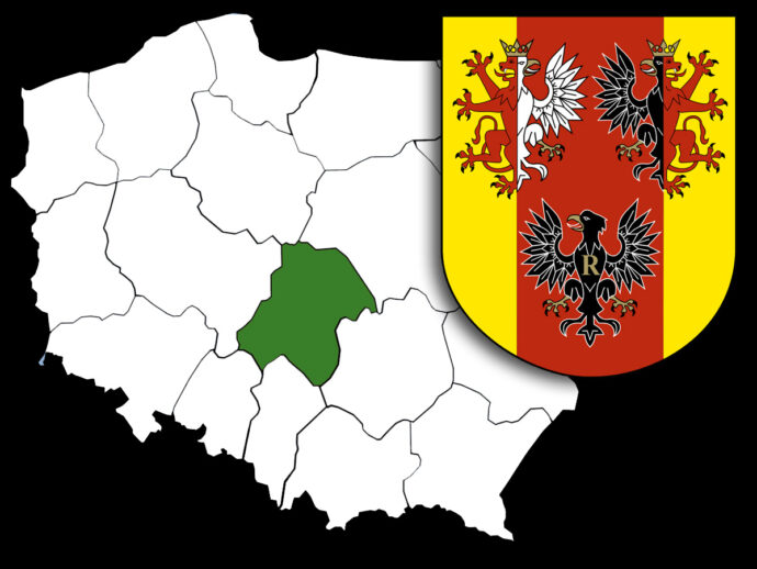 Map of Albania with a single region shaded green, and the Albanian coat of arms overlaid in the top-right.